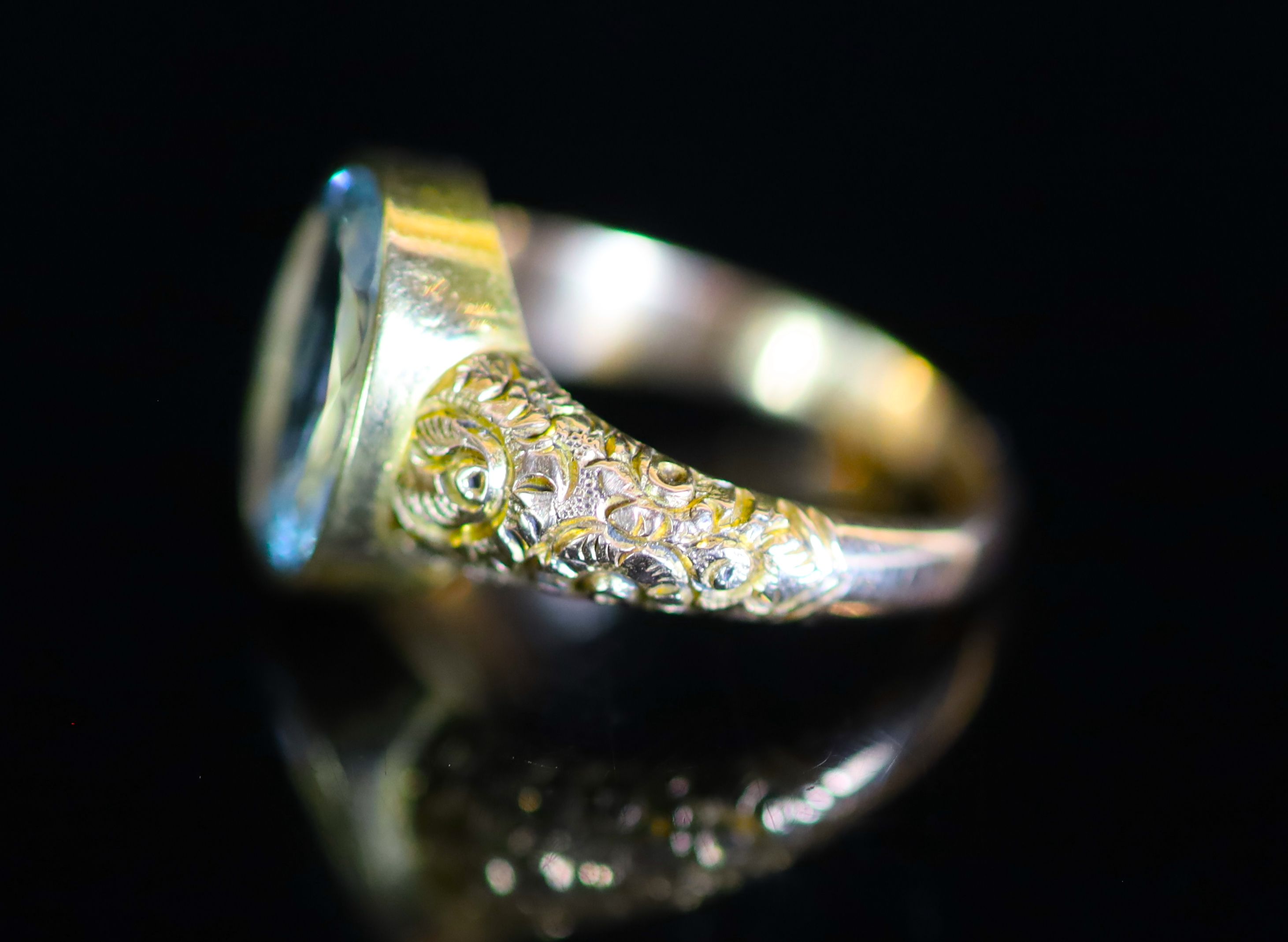 A Victorian style gold and single stone oval cut aquamarine dress ring